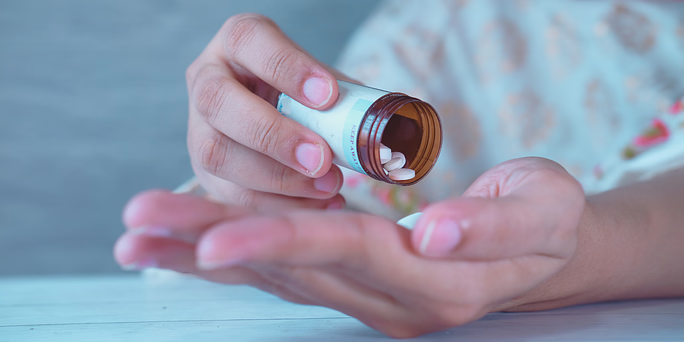 woman taking an abortion pill